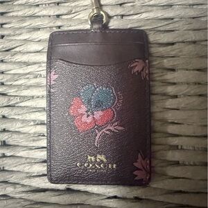 Used Coach Burgundy Card/IDHolder only with Floral Accents without lanyard.